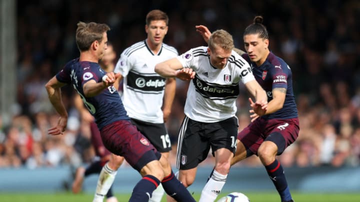 LONDON, ENGLAND - OCTOBER 07: Andre Schurrle of Fulham battles for possession with Hector Bellerin, and Nacho Monreal of Arsenal during the Premier League match between Fulham FC and Arsenal FC at Craven Cottage on October 7, 2018 in London, United Kingdom. (Photo by Catherine Ivill/Getty Images)