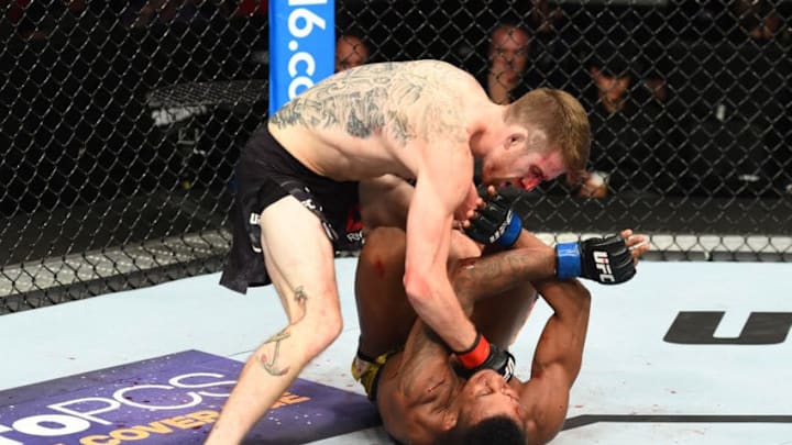 LINCOLN, NE - AUGUST 25: (L-R) Cory Sandhagen punches Iuri Alcantara of Brazil in their bantamweight fight during the UFC Fight Night event at Pinnacle Bank Arena on August 25, 2018 in Lincoln, Nebraska. (Photo by Josh Hedges/Zuffa LLC/Zuffa LLC via Getty Images)