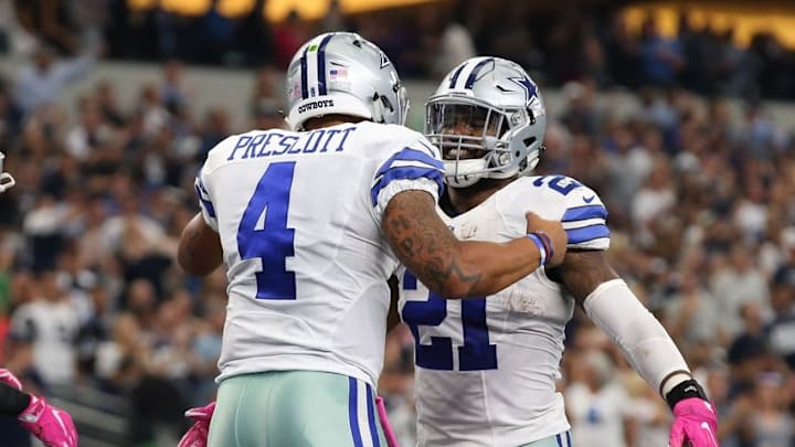 Oct 9, 2016; Arlington, TX, USA; Dallas Cowboys quarterback Dak Prescott (4) celebrates his touchdown in the second quarter with running back Ezekiel Elliott (21) against the Cincinnati Bengals at AT&T Stadium. Mandatory Credit: Matthew Emmons-USA TODAY Sports