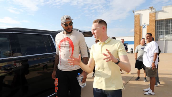 OKLAHOMA CITY, OK - SEPTEMBER 24: Carmelo Anthony of the Oklahoma City Thunder is greeted Sam Presti, General Manager of the Oklahoma City Thunder, as he arrives at Will Rogers Airport on September 24, 2017 in Oklahoma City, Oklahoma. NOTE TO USER: User expressly acknowledges and agrees that, by downloading and or using this Photograph, user is consenting to the terms and conditions of the Getty Images License Agreement. Mandatory Copyright Notice: Copyright 2017 NBAE (Photo by Layne Murdoch/NBAE via Getty Images)
