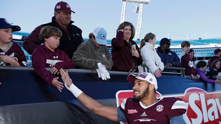JACKSONVILLE, FL - DECEMBER 30: Montez Sweat #9 of the Mississippi State Bulldogs celebrates with fans following the TaxSlayer Bowl against the Louisville Cardinals at EverBank Field on December 30, 2017 in Jacksonville, Florida. The Bulldogs won 31-27. (Photo by Joe Robbins/Getty Images)