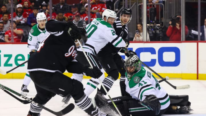 Dec 13, 2022; Newark, New Jersey, USA; New Jersey Devils left wing Miles Wood (44) looks for the puck after a save by Dallas Stars goaltender Scott Wedgewood (41) during the second period at Prudential Center. Mandatory Credit: Ed Mulholland-USA TODAY Sports