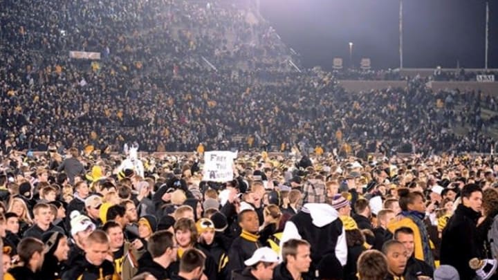 Nov 30, 2013; Columbia, MO, USA; Missouri Tigers students and fans storm the field after the game against the Texas A