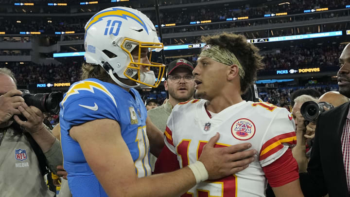 INGLEWOOD, CALIFORNIA – NOVEMBER 20: Justin Herbert #10 of the Los Angeles Chargers and Patrick Mahomes #15 of the Kansas City Chiefs embraces after the game at SoFi Stadium on November 20, 2022 in Inglewood, California. (Photo by Kevork Djansezian/Getty Images)