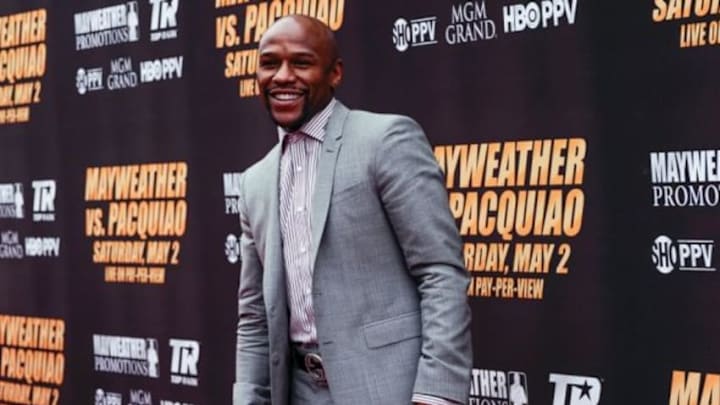 Mar 11, 2015; Los Angeles, CA, USA; Floyd Mayweather arrives on the red carpet before a press conference to announce the fight on May 2, 2015 against Manny Pacquiao at Los Angeles. Mandatory Credit: Robert Hanashiro-USA TODAY Sports