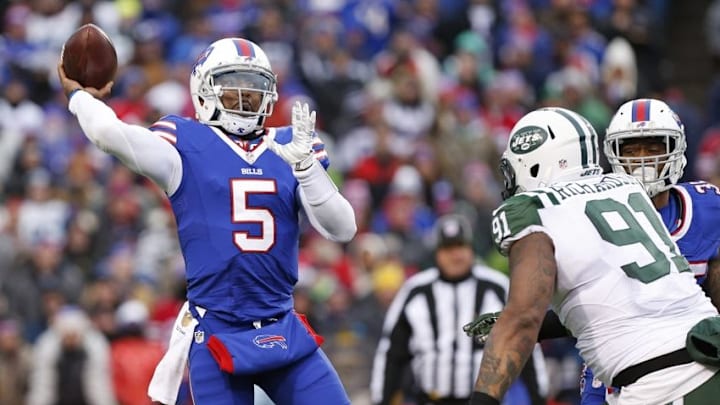 Jan 3, 2016; Orchard Park, NY, USA; Buffalo Bills quarterback Tyrod Taylor (5) throws a pass under pressure by New York Jets defensive end Sheldon Richardson (91) during the second half at Ralph Wilson Stadium. Bills beat the Jets 22-17. Mandatory Credit: Kevin Hoffman-USA TODAY Sports