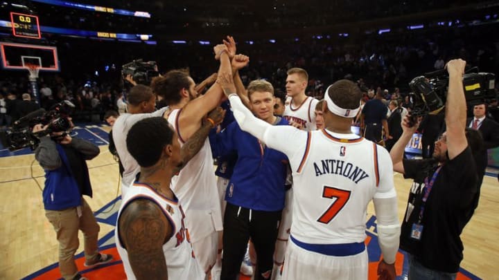 Dec 20, 2016; New York, NY, USA; New York Knicks forward Carmelo Anthony (7) and teammates celebrate their win against the Indiana Pacers at Madison Square Garden. Mandatory Credit: Adam Hunger-USA TODAY Sports