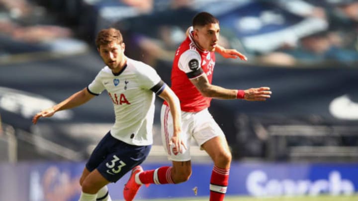 LONDON, ENGLAND – JULY 12: Ben Davies of Tottenham Hotspur battles for possession with Hector Bellerin of Arsenal during the Premier League match between Tottenham Hotspur and Arsenal FC at Tottenham Hotspur Stadium on July 12, 2020 in London, England. Football Stadiums around Europe remain empty due to the Coronavirus Pandemic as Government social distancing laws prohibit fans inside venues resulting in all fixtures being played behind closed doors. (Photo by Julian Finney/Getty Images)