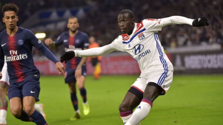 Lyon's French defender Ferland Mendy (R) shoots the ball next to Paris Saint-Germain's German defender Thilo Kehrer during the French L1 football match between Olympique Lyonnais (OL) and Paris-Saint Germain (PSG) at Groupama stadium in Decines-Charpieu, near Lyon, on February 3, 2019. (Photo by ROMAIN LAFABREGUE / AFP) (Photo credit should read ROMAIN LAFABREGUE/AFP/Getty Images)