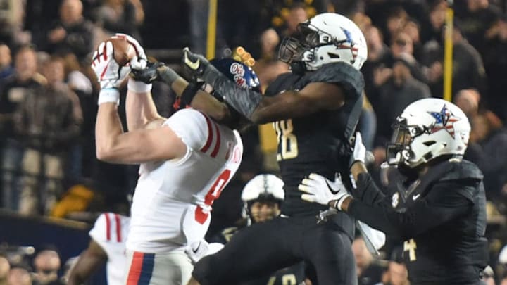 NASHVILLE, TN - NOVEMBER 17: Dawson Knox #9 of the Ole Miss Rebels makes a catch while being defended by Allan George #28 of the Vanderbilt Commodores during the second half at Vanderbilt Stadium on November 17, 2018 in Nashville, Tennessee. (Photo by Frederick Breedon/Getty Images)