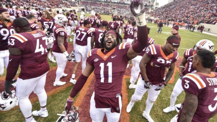 BLACKSBURG, VA - NOVEMBER 18: Defensive end Houshun Gaines #11 of the Virginia Tech Hokies sings the fight song following the game against the Pittsburgh Panthers at Lane Stadium on November 18, 2017 in Blacksburg, Virginia. (Photo by Michael Shroyer/Getty Images)