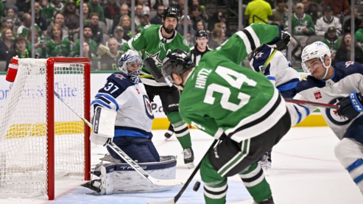 Oct 17, 2022; Dallas, Texas, USA; Winnipeg Jets goaltender Connor Hellebuyck (37) faces a shot by Dallas Stars center Roope Hintz (24) during the second period at the American Airlines Center. Mandatory Credit: Jerome Miron-USA TODAY Sports