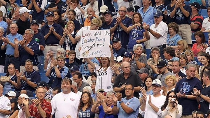 April 8, 2012; St. Petersburg, FL, USA; Tampa Bay Rays fan hold up a sign during the game against the New York Yankees at Tropicana Field. Mandatory Credit: Kim Klement-USA TODAY Sports