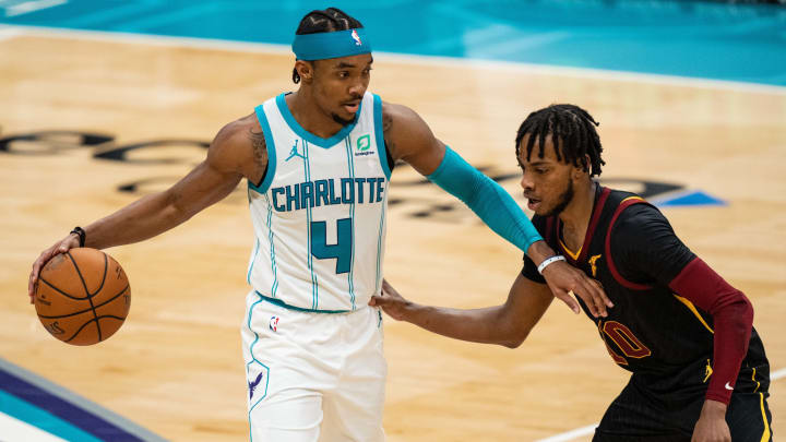 CHARLOTTE, NORTH CAROLINA – APRIL 14: Devonte’ Graham #4 of the Charlotte Hornets brings the ball up court while guarded by Darius Garland #10 of the Cleveland Cavaliers in the third quarter during their game at Spectrum Center on April 14, 2021 in Charlotte, North Carolina. NOTE TO USER: User expressly acknowledges and agrees that, by downloading and or using this photograph, User is consenting to the terms and conditions of the Getty Images License Agreement. (Photo by Jacob Kupferman/Getty Images)