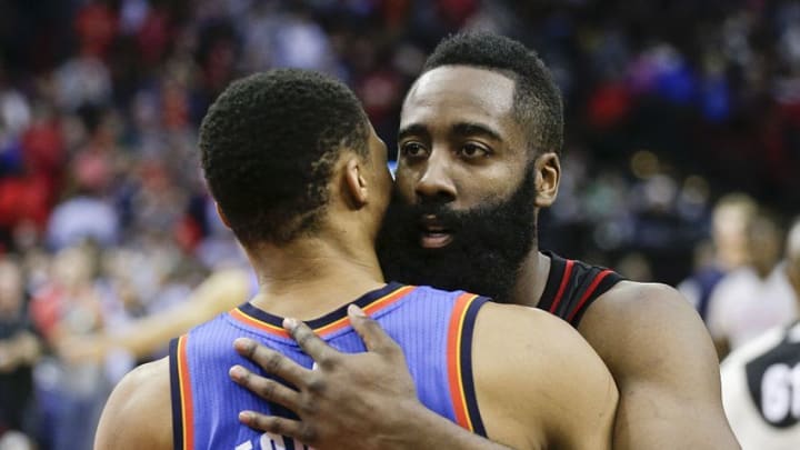 Jan 5, 2017; Houston, TX, USA; Houston Rockets guard James Harden (13) hugs Oklahoma City Thunder guard Russell Westbrook (0) after the Rockets defeated the City Thunder at Toyota Center. Houston Rockets won 118 to 116. Mandatory Credit: Thomas B. Shea-USA TODAY Sports