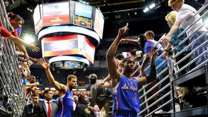 Apr 12, 2013; New Orleans, LA, USA; Los Angeles Clippers guard Chris Paul (3) and Blake Griffin (32) shake hands with fans as the leave the court following their 96-93 victory against the New Orleans Hornets at the New Orleans Arena. Mandatory Credit: Crystal LoGiudice-USA TODAY Sports