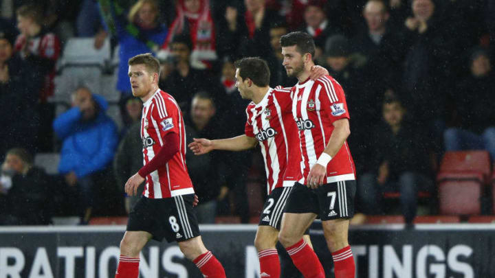 SOUTHAMPTON, ENGLAND - JANUARY 13: Shane Long (R) of Southampton celebrates scoring his team's first goal with his team mates Steven Davis (L) and Cedric Soares (C) during the Barclays Premier League match between Southampton and Watford at St. Mary's Stadium on January 13, 2016 in Southampton, England. (Photo by Ian Walton/Getty Images)