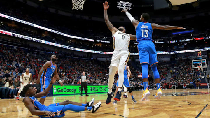 NEW ORLEANS, LA - NOVEMBER 20: DeMarcus Cousins #0 of the New Orleans Pelicans shoots against Paul George #13 of the Oklahoma City Thunder during the first half at the Smoothie King Center on November 20, 2017 in New Orleans, Louisiana. NOTE TO USER: User expressly acknowledges and agrees that, by downloading and or using this photograph, User is consenting to the terms and conditions of the Getty Images License Agreement. (Photo by Sean Gardner/Getty Images)