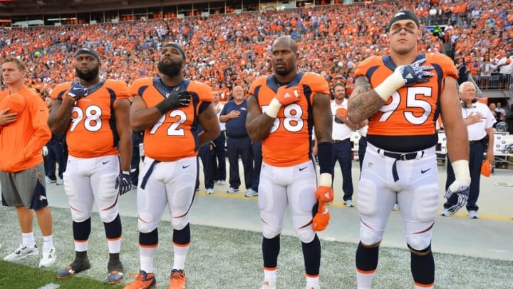 Sep 8, 2016; Denver, CO, USA; Denver Broncos defensive end Derek Wolfe (95) and outside linebacker Von Miller (58) and nose tackle Sylvester Williams (92) and nose tackle Darius Kilgo (98) during the national anthem before the start of the game against the Carolina Panthers at Sports Authority Field at Mile High. The Broncos defeated the Panthers 21-20. Mandatory Credit: Ron Chenoy-USA TODAY Sports