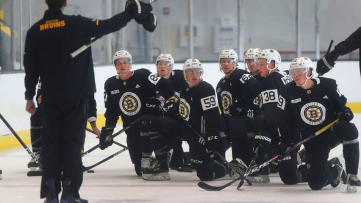 BOSTON - JUNE 26: The first group take a knee as they get instructions before a drill during a Boston Bruins development camp at Warrior Ice Arena in the Brighton neighborhood of Boston on June 26, 2019. (Photo by John Tlumacki/The Boston Globe via Getty Images)