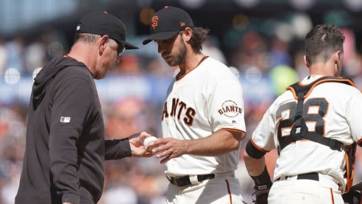 SAN FRANCISCO, CA - APRIL 13: Manager Bruce Bochy #15 of the San Francisco Giants takes the ball from pitcher Madison Bumgarner #40 taking Bumgarner out of the game against the Colorado Rockies in the top of the eighth inning at Oracle Park on April 13, 2019 in San Francisco, California. (Photo by Thearon W. Henderson/Getty Images)