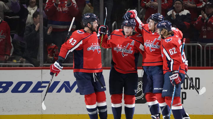 WASHINGTON, DC – FEBRUARY 04: John Carlson #74 of the Washington Capitals celebrates with his teammates after scoring a goal against the Los Angeles Kings in the second period at Capital One Arena on February 04, 2020 in Washington, DC. (Photo by Patrick McDermott/NHLI via Getty Images)