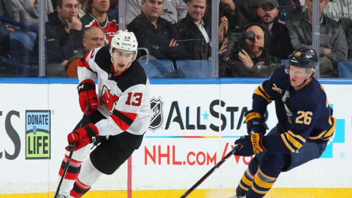 BUFFALO, NY - JANUARY 8: Nico Hischier #13 of the New Jersey Devils controls the puck against Rasmus Dahlin #26 of the Buffalo Sabres during an NHL game on January 8, 2019 at KeyBank Center in Buffalo, New York. Buffalo won, 5-1. (Photo by Bill Wippert/NHLI via Getty Images) BUFFALO, NY - JANUARY 8: Nico Hischier #13 of the New Jersey Devils controls the puck against Rasmus Dahlin #26 of the Buffalo Sabres during an NHL game on January 8, 2019 at KeyBank Center in Buffalo, New York. Buffalo won, 5-1. (Photo by Bill Wippert/NHLI via Getty Images)