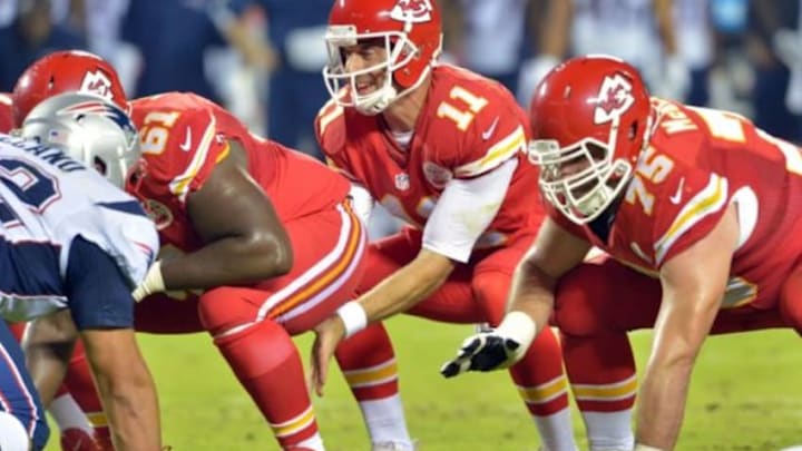 Sep 29, 2014; Kansas City, MO, USA; Kansas City Chiefs quarterback Alex Smith (11) goes under center during the second half against the New England Patriots at Arrowhead Stadium. The Chiefs won 41-14. Mandatory Credit: Denny Medley-USA TODAY Sports