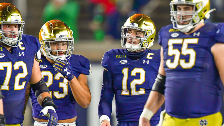 Nov 7, 2020; South Bend, Indiana, USA; Notre Dame Fighting Irish quarterback Ian Book (12) walks to the line of scrimmage in the first quarter against the Clemson Tigers at Notre Dame Stadium. Notre Dame defeated Clemson 47-40 in two overtimes. Mandatory Credit: Matt Cashore-USA TODAY Sports