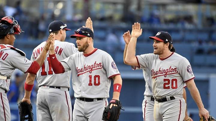 Oct 10, 2016; Los Angeles, CA, USA; Washington Nationals second baseman Stephen Drew (10) and second baseman Daniel Murphy (20) celebrate with teammate after beating the Los Angeles Dodgers in game three of the 2016 NLDS playoff baseball series at Dodger Stadium. Mandatory Credit: Richard Mackson-USA TODAY Sports Oct 10, 2016; Los Angeles, CA, USA; Washington Nationals second baseman Stephen Drew (10) and second baseman Daniel Murphy (20) celebrate with teammate after beating the Los Angeles Dodgers in game three of the 2016 NLDS playoff baseball series at Dodger Stadium. Mandatory Credit: Richard Mackson-USA TODAY Sports