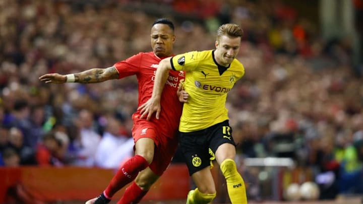 LIVERPOOL, ENGLAND - APRIL 14: Nathaniel Clyne of Liverpool challenges Marco Reus of Borussia Dortmund during the UEFA Europa League quarter final, second leg match between Liverpool and Borussia Dortmund at Anfield on April 14, 2016 in Liverpool, United Kingdom. (Photo by Clive Brunskill/Getty Images)