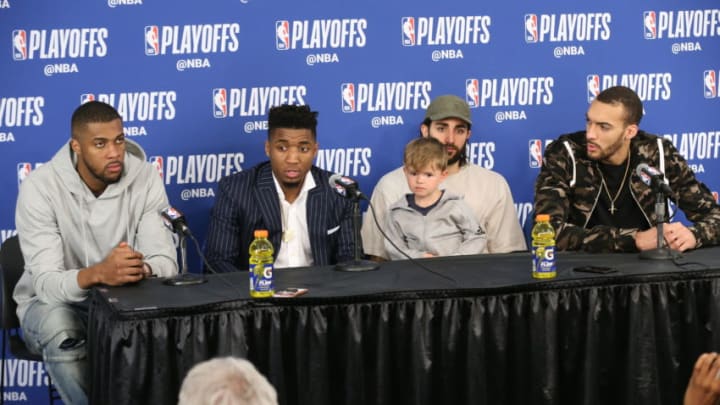 OKLAHOMA CITY, OK - APRIL 18 - Derrick Favors #15 Donovan Mitchell #45 Ricky Rubio #3 and Rudy Gobert #27 of the Utah Jazz talk to the media after Game Two of Round One of the 2018 NBA Playoffs Oklahoma City Thunder on April 18 2018 at Chesapeake Energy Arena in Oklahoma City, Oklahoma. NOTE TO USER: User expressly acknowledges and agrees that, by downloading and or using this photograph, User is consenting to the terms and conditions of the Getty Images License Agreement. Mandatory Copyright Notice: Copyright 2018 NBAE (Photo by Layne Murdoch Sr./NBAE via Getty Images)