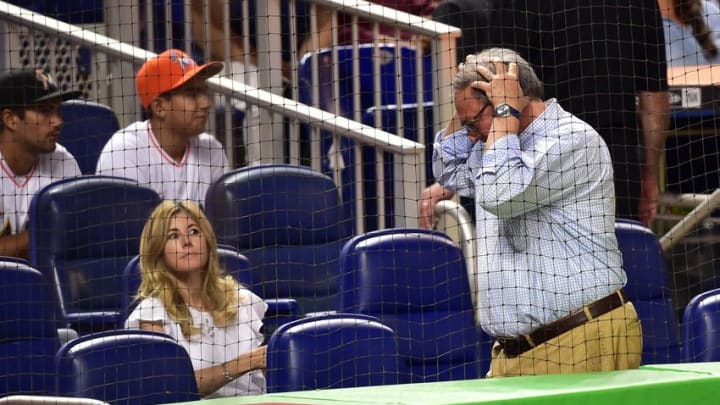 Jul 30, 2016; Miami, FL, USA; Miami Marlins owner Jeffrey Loria (right) reacts after newly acquired starting pitcher Colin Rea (not pictured) injured his arm and was taken out of the game during the fourth inning against the St. Louis Cardinals at Marlins Park. Mandatory Credit: Steve Mitchell-USA TODAY Sports