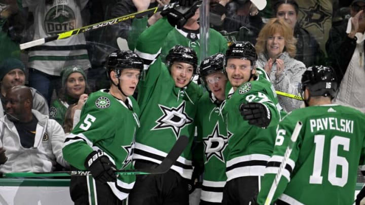 Feb 14, 2023; Dallas, Texas, USA; Dallas Stars left wing Jason Robertson (21) and defenseman Ryan Suter (20) and defenseman Nils Lundkvist (5) and center Roope Hintz (24) and center Joe Pavelski (16) celebrate a goal scored by Robertson against the Boston Bruins during the second period at the American Airlines Center. Mandatory Credit: Jerome Miron-USA TODAY Sports