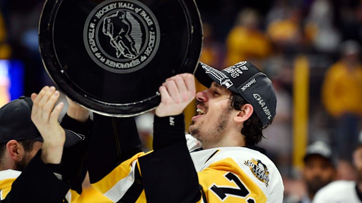 Jun 11, 2017; Nashville, TN, USA; Pittsburgh Penguins center Evgeni Malkin (71) hoists the Stanley Cup after defeating the Nashville Predators in game six of the 2017 Stanley Cup Final at Bridgestone Arena. Mandatory Credit: Christopher Hanewinckel-USA TODAY Sports