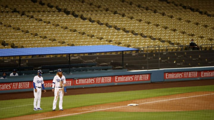 LOS ANGELES, CALIFORNIA - JULY 26: Justin Turner #10 of the Los Angeles Dodgers stands on third base after a single by Cody Bellinger #35 during the third inning against the San Francisco Giants at Dodger Stadium on July 26, 2020 in Los Angeles, California. (Photo by Katelyn Mulcahy/Getty Images)