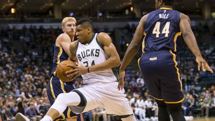 Mar 2, 2016; Milwaukee, WI, USA; Milwaukee Bucks forward Giannis Antetokounmpo (34) drives for the basket between Indiana Pacers forward Chase Budinger (10) and forward Solomon Hill (44) during the second quarter at BMO Harris Bradley Center. Mandatory Credit: Jeff Hanisch-USA TODAY Sports