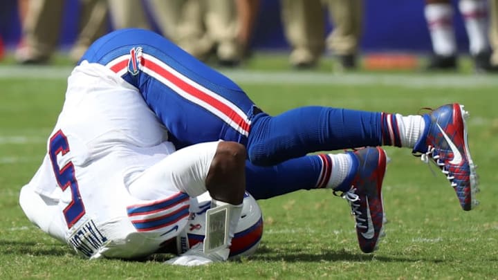 Sep 11, 2016; Baltimore, MD, USA; Buffalo Bills quarterback Tyrod Taylor (5) lays upside down after being tackled against the Baltimore Ravens defense at M&T Bank Stadium. Mandatory Credit: Mitch Stringer-USA TODAY Sports