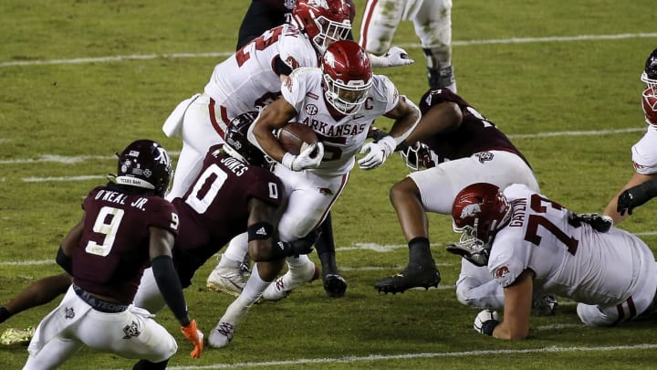 COLLEGE STATION, TEXAS – OCTOBER 31: Rakeem Boyd #5 of the Arkansas Razorbacks is tackled by Myles Jones #0 of the Texas A&M Aggies in the third quarter at Kyle Field on October 31, 2020 in College Station, Texas. (Photo by Tim Warner/Getty Images)