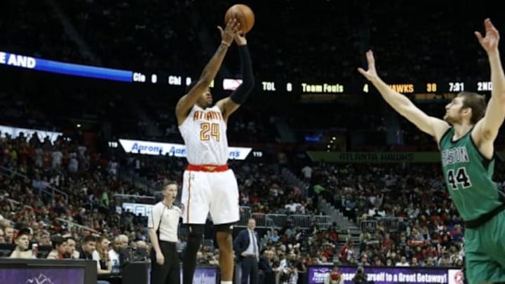Apr 9, 2016; Atlanta, GA, USA; Atlanta Hawks forward Kent Bazemore (24) attempts a three-point basket against Boston Celtics center Tyler Zeller (44) in the second quarter of their game at Philips Arena. The Hawks won 118-107. Mandatory Credit: Jason Getz-USA TODAY Sports