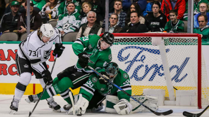 DALLAS, TX - JANUARY 30: Dallas Stars goaltender Ben Bishop (30) reaches for the puck as defenseman Esa Lindell (23) and Los Angeles Kings center Tyler Toffoli (73) fall over him during the game between the Dallas Stars and the Los Angeles Kings on Tuesday January 30, 2018 at the American Airlines Center in Dallas, Texas. Los Angeles defeats Dallas 3-0. (Photo by Matthew Pearce/Icon Sportswire via Getty Images)