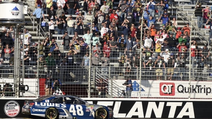 Feb 28, 2016; Hampton, GA, USA; NASCAR Sprint Cup Series driver Jimmie Johnson (48) celebrates after winning the Folds of Honor QuikTrip 500 at Atlanta Motor Speedway. Mandatory Credit: John David Mercer-USA TODAY Sports