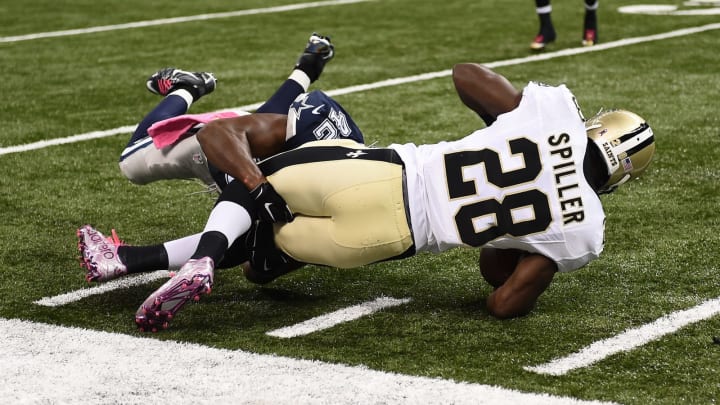 NEW ORLEANS, LA – OCTOBER 04: C.J. Spiller #28 of the New Orleans Saints is tackled by Barry Church #42 of the Dallas Cowboys during the third quarter against the New Orleans Saints at Mercedes-Benz Superdome on October 4, 2015 in New Orleans, Louisiana. (Photo by Stacy Revere/Getty Images)
