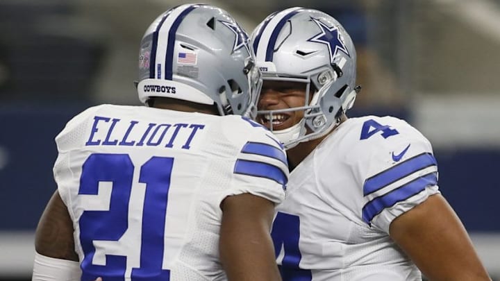 Oct 9, 2016; Arlington, TX, USA; Dallas Cowboys running back Ezekiel Elliott (21) celebrates with quarterback Dak Prescott (4) after scoring a touchdown in the third quarter against the Cincinnati Bengals at AT&T Stadium. Mandatory Credit: Tim Heitman-USA TODAY Sports