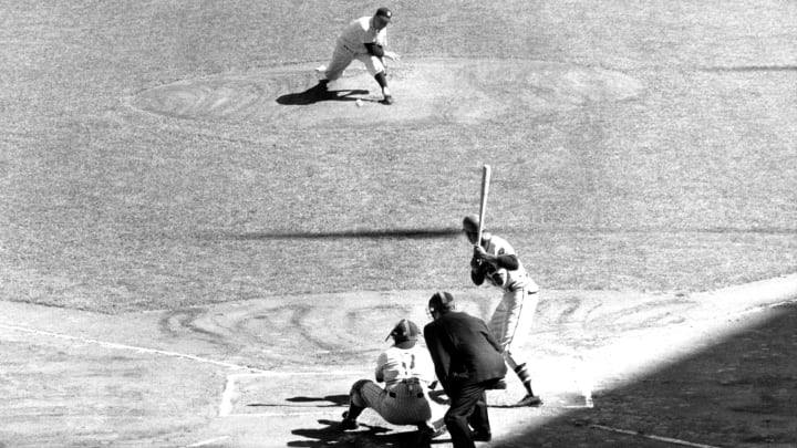 BRONX, NY – OCTOBER 6: Pitcher Bob Turley No. 19 of the New York Yankees throws the first pitch of Game 5 of the 1958 World Series to Bill Bruton No. 38 of the Milwaukee Braves as catcher Yogi Berra No. 8 of the Yankees and umpire Al Barlick wait for the ball on October 6, 1958 at Yankee Stadium in Bronx, New York. (Photo by B Bennett/Bruce Bennett Studios/Getty Images)