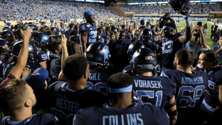 CHAPEL HILL, NORTH CAROLINA - OCTOBER 26: Javonte Williams #25 of the North Carolina Tar Heels celebrates with teammates after defeating the Duke Blue Devils 201-17 at Kenan Stadium on October 26, 2019 in Chapel Hill, North Carolina. (Photo by Streeter Lecka/Getty Images)