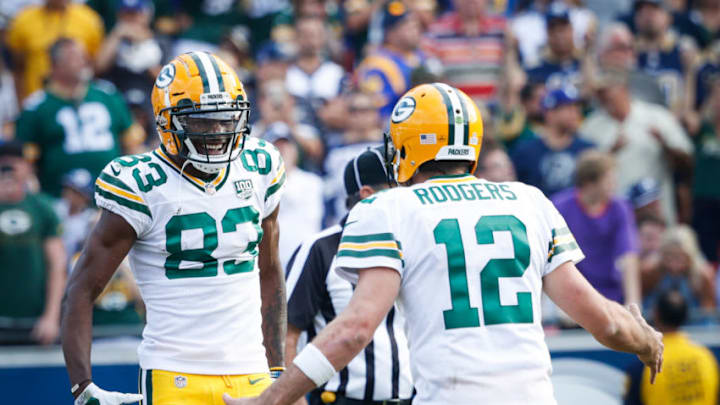 Daily Fantasy Football: LOS ANGELES, CA - OCTOBER 28: Wide receiver Marquez Valdes-Scantling #83 and quarterback Aaron Rodgers #12 of the Green Bay Packers celebrate after a touchdown in the fourth quarter against the Los Angeles Rams at Los Angeles Memorial Coliseum on October 28, 2018 in Los Angeles, California. (Photo by Joe Robbins/Getty Images)