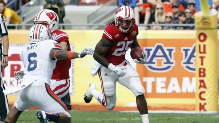 Jan 1, 2015; Tampa, FL, USA; Wisconsin Badgers running back Melvin Gordon (25) runs the ball against the Auburn Tigers during the first half in the 2015 Outback Bowl at Raymond James Stadium. Mandatory Credit: Mark Zerof-USA TODAY Sports