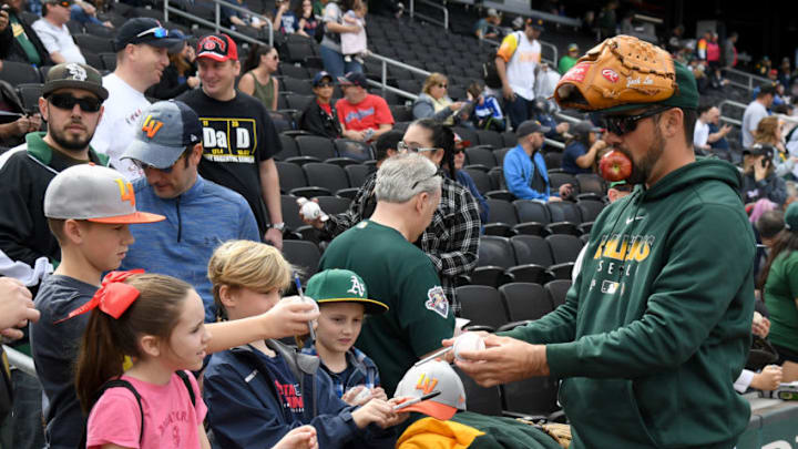 LAS VEGAS, NEVADA - FEBRUARY 29: Zach Lee #77 of the Oakland Athletics signs autographs for fans before an exhibition game against the the Cleveland Indians at Las Vegas Ballpark on February 29, 2020 in Las Vegas, Nevada. The Athletics defeated the Indians 8-6. (Photo by Ethan Miller/Getty Images)