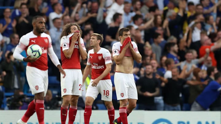 Arsenal's French striker Alexandre Lacazette (L), Arsenal's French midfielder Matteo Guendouzi, Arsenal's Spanish defender Nacho Monreal and Arsenal's Greek defender Sokratis Papastathopoulos react after conceding the third goal during the English Premier League football match between Chelsea and Arsenal at Stamford Bridge in London on August 18, 2018. - Chelsea won the game 3-2. (Photo by Daniel LEAL-OLIVAS / AFP) / RESTRICTED TO EDITORIAL USE. No use with unauthorized audio, video, data, fixture lists, club/league logos or 'live' services. Online in-match use limited to 120 images. An additional 40 images may be used in extra time. No video emulation. Social media in-match use limited to 120 images. An additional 40 images may be used in extra time. No use in betting publications, games or single club/league/player publications. / (Photo credit should read DANIEL LEAL-OLIVAS/AFP/Getty Images)